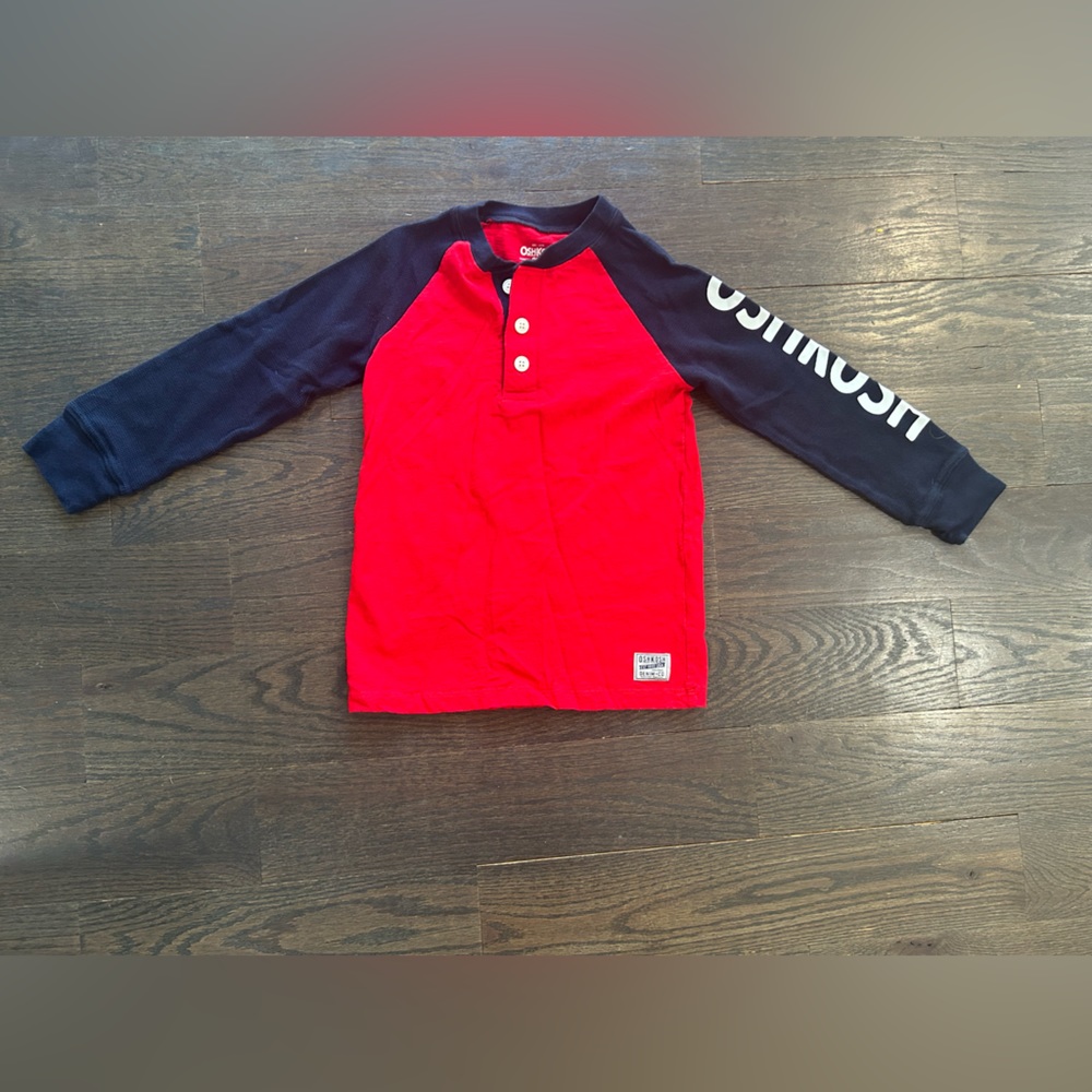 Boys size 7 Oshkosh shirt  never worn  tags removed   Logo on left arm